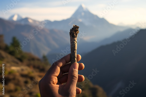 Hand holding a incense stick, smoke, himalaya incense, smell, prayer