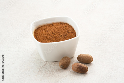 Pala Bubuk (Nutmeg Powder) on white bowl
 photo