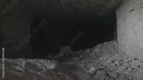 Limestone quarry (stone sawing), which is 200 years old. Underground halls, piles of sawn stones, zigzag corridors, dead ends, niches. Object for spelunking photo