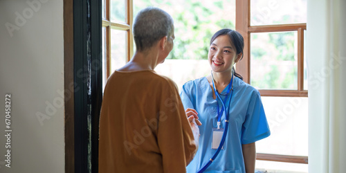 Elderly open door to doctors come for annual home health check-ups based on home health visit services photo