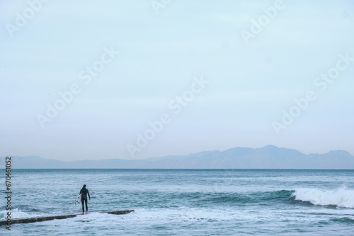 Surfers embarking on a surf session