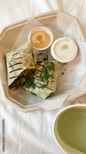 Grilled wrap with vegetables in a take away box