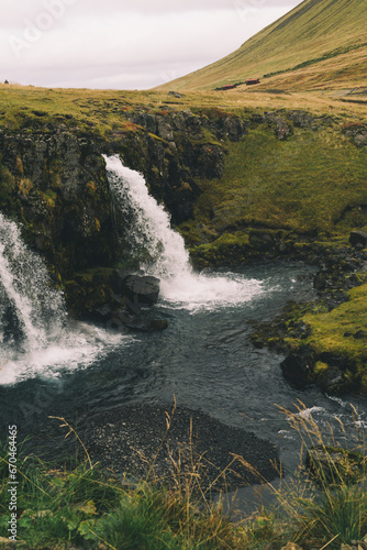 Beautifull arrowhead mountain Kirkjufell and waterfall on Snaefellsnes peninsula  Iceland