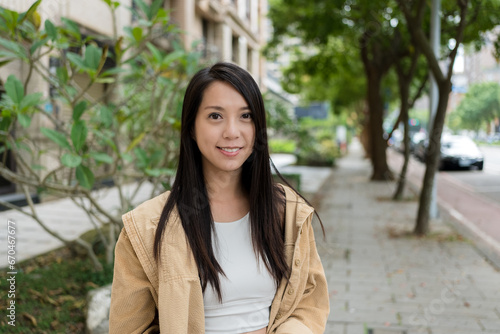 Young asian woman smile to camera