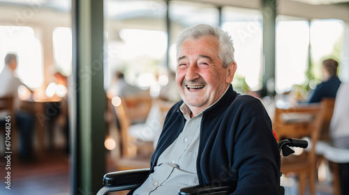 Portrait of a happy senior man sitting on wheelchair. Cheerful old man sitting on wheelchair. Disabled man in his wheelchair looking at camera. photo