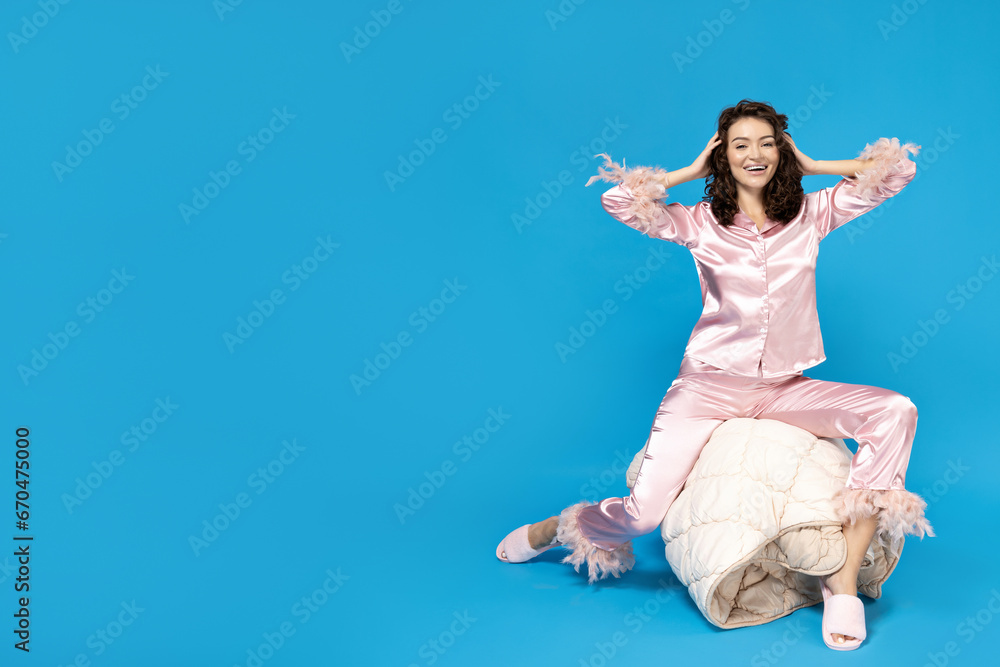 Girl in pink pajamas on a blue background. Girl in pink pajamas on a blue background.