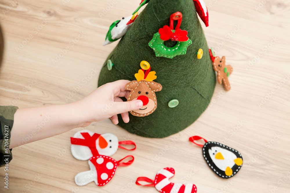 Christmas tree toy handmade from felt. Ergo therapy task for education. Fine motor skills for kids and disabled. Montessori methodology. Development, education. Activities at home.