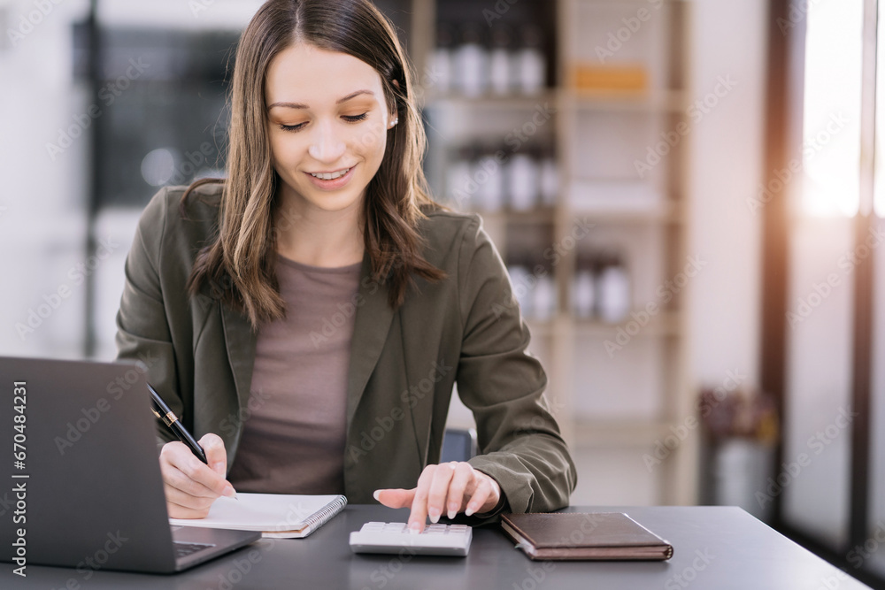 Hand women doing finances and calculate on desk about cost at home office.