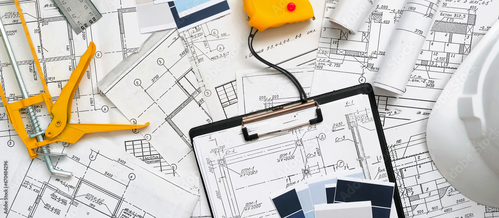 Architect works remotely from home Remote work, stay home, new normality, social distance. Architect design working drawing sketch plans blueprints Architect works remotely from home Remote work, stay home, new normality, social distance. Architect design working drawing sketch plans blueprints