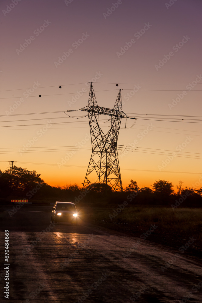 night driving a car, electricity high voltage pole in the background