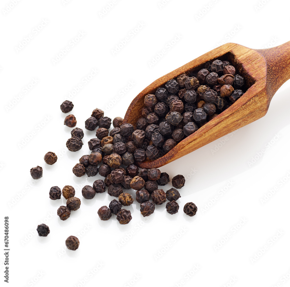 Black pepper in wooden spoon isolated on white background Black pepper in wooden spoon isolated on white background