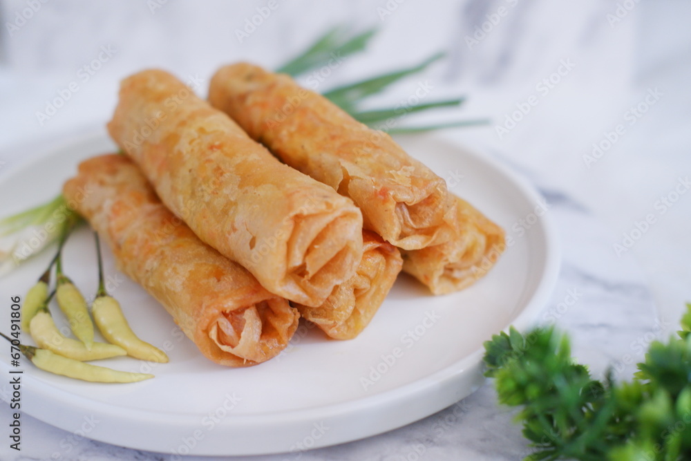 Lumpia or lunpia, traditional snacks from Semarang, Central Java, Indonesia. Traditional spring roll Lumpia or lunpia, traditional snacks from Semarang, Central Java, Indonesia. Traditional spring roll