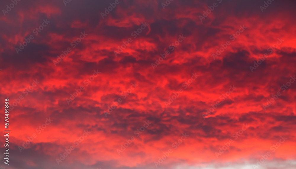 Flaming red sky with abstract clouds.