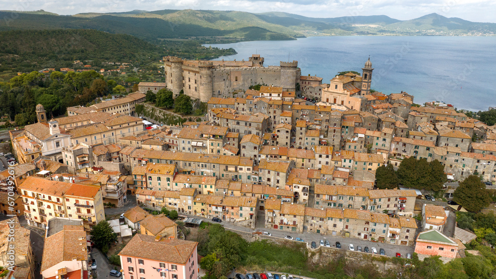 Aerial view of Bracciano, in the metropolitan city of Rome, Italy. The town is located on the shores of Lake Bracciano. In the historic center there is the castle and cathedral of Santo Stefano.