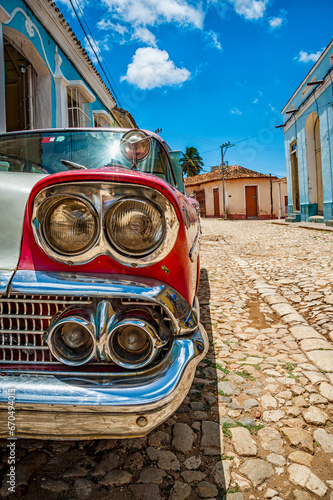Old classic car detail in a road of Trinidad in Cuba photo