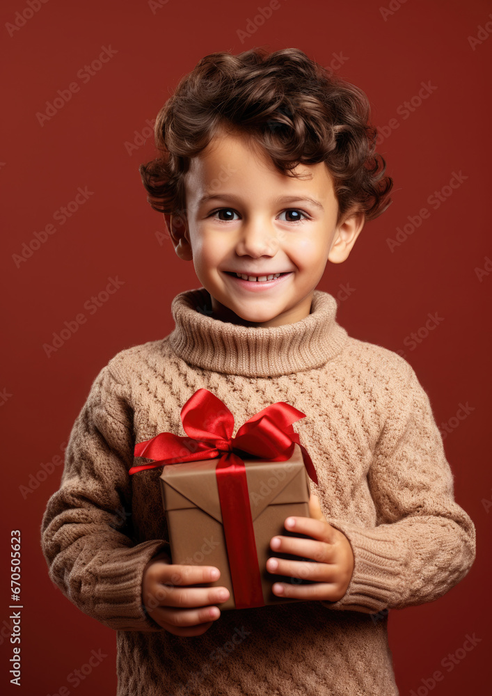 little cute boy holding gift box with ribbons on color background, child in knitted sweater, smiling happy kid, new year, christmas, eve, present, kindergarten, childhood, holiday, winter, toddler little cute boy holding gift box with ribbons on color background, child in knitted sweater, smiling happy kid, new year, christmas, eve, present, kindergarten, childhood, holiday, winter, toddler