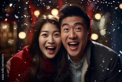 asian filipino couple celebrating christmas time with many presents and christmas decoration.