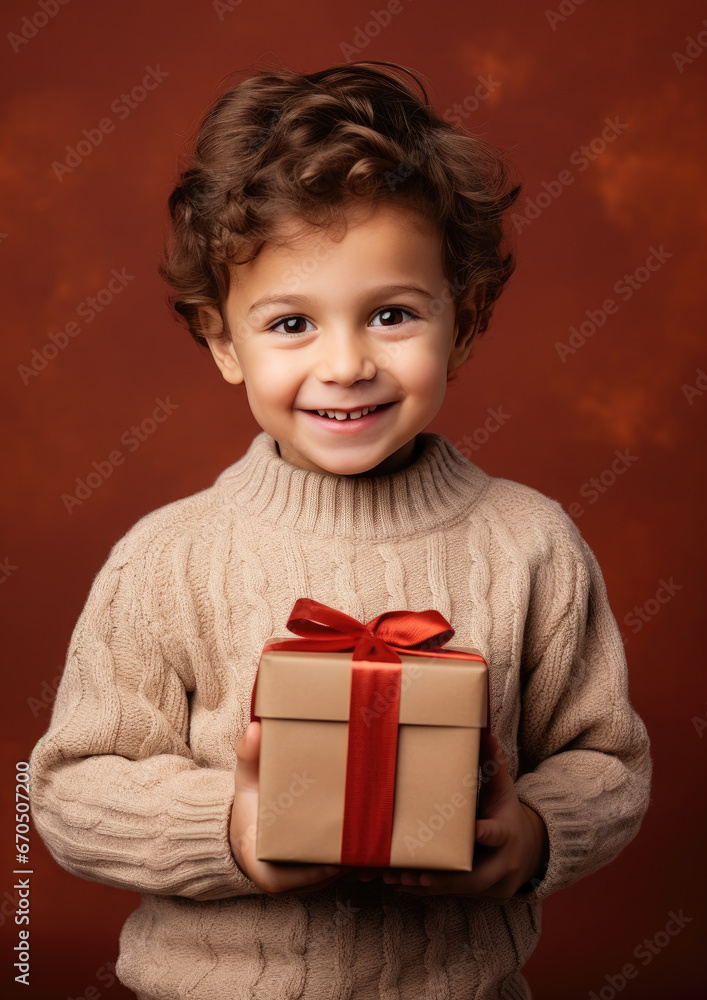 little cute boy holding gift box with ribbons on color background, child in knitted sweater, smiling happy kid, new year, christmas, eve, present, kindergarten, childhood, holiday, winter, toddler little cute boy holding gift box with ribbons on color background, child in knitted sweater, smiling happy kid, new year, christmas, eve, present, kindergarten, childhood, holiday, winter, toddler