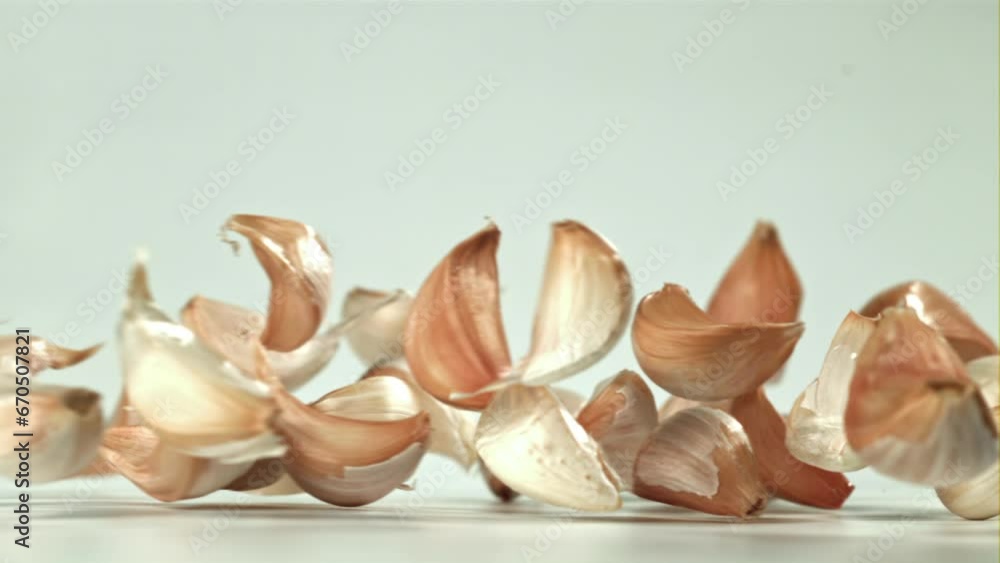 Fresh garlic falls on the table. Filmed on a high-speed camera at 1000 fps. High quality FullHD footage Fresh garlic falls on the table. Filmed on a high-speed camera at 1000 fps. High quality FullHD footage