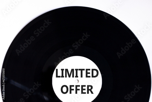 Limited offer symbol. Concept words Limited offer on beautiful black old retro vinyl disc. Beautiful white table white background. Business marketing, motivational Limited offer concept. Copy space.