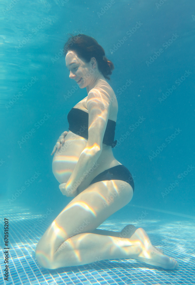 Pregnant woman in the pool.