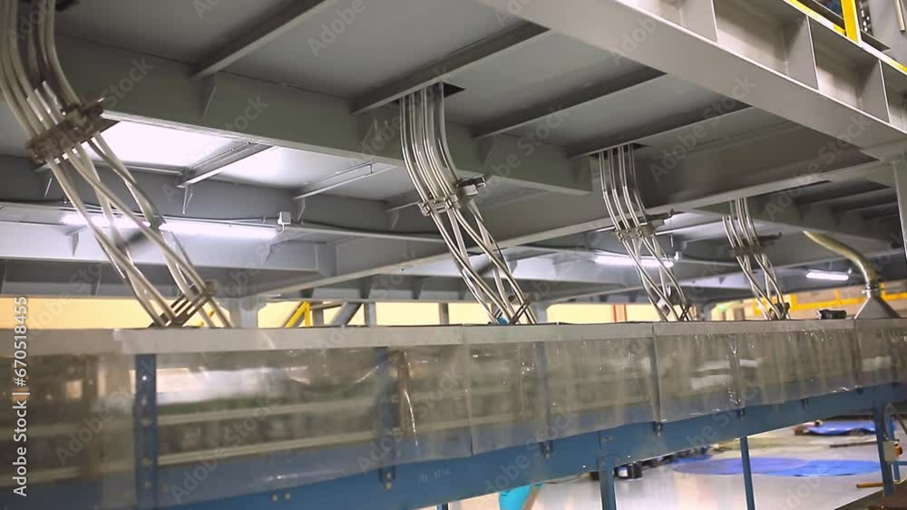 Conveyor line with the production of aluminum cans. Production of aluminum cans for drinks. Plant of high-tech equipment for the food industry. Conveyor line with the production of aluminum cans. Production of aluminum cans for drinks. Plant of high-tech equipment for the food industry.