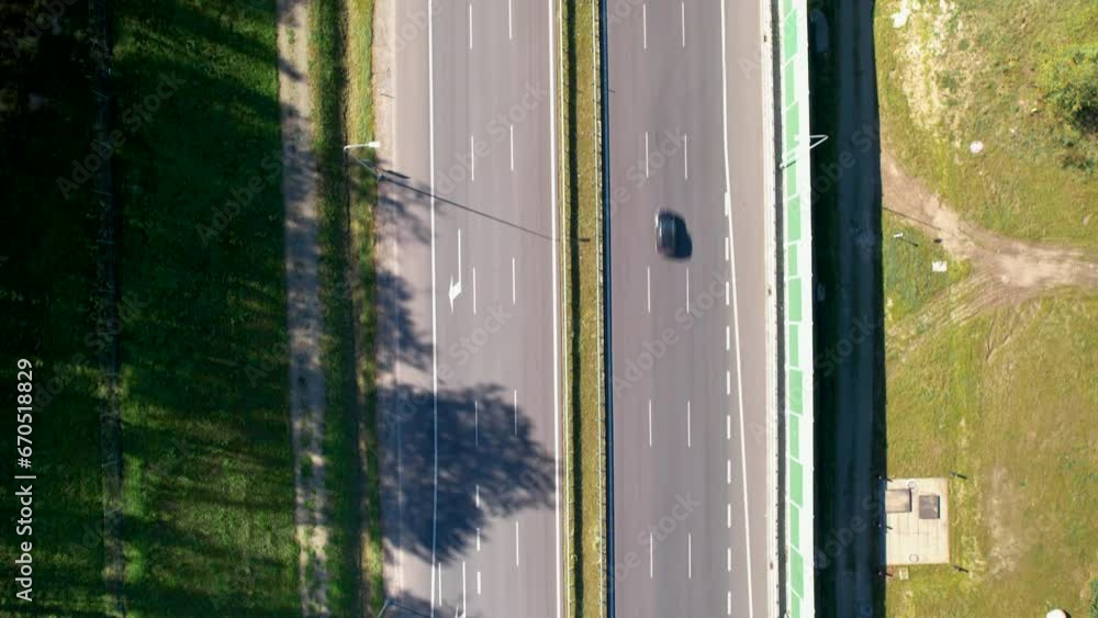 Aerial top down shot of cars on highway in suburb area of Gdynia during sunny day Aerial top down shot of cars on highway in suburb area of Gdynia during sunny day