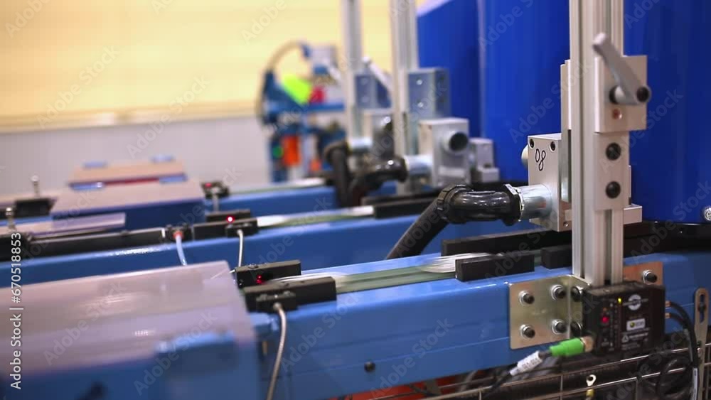Modern factory for the production of food packaging. Production of aluminum cans. A mechanical press extrudes aluminum can blanks from food-grade aluminum foil. Modern factory for the production of food packaging. Production of aluminum cans. A mechanical press extrudes aluminum can blanks from food-grade aluminum foil.
