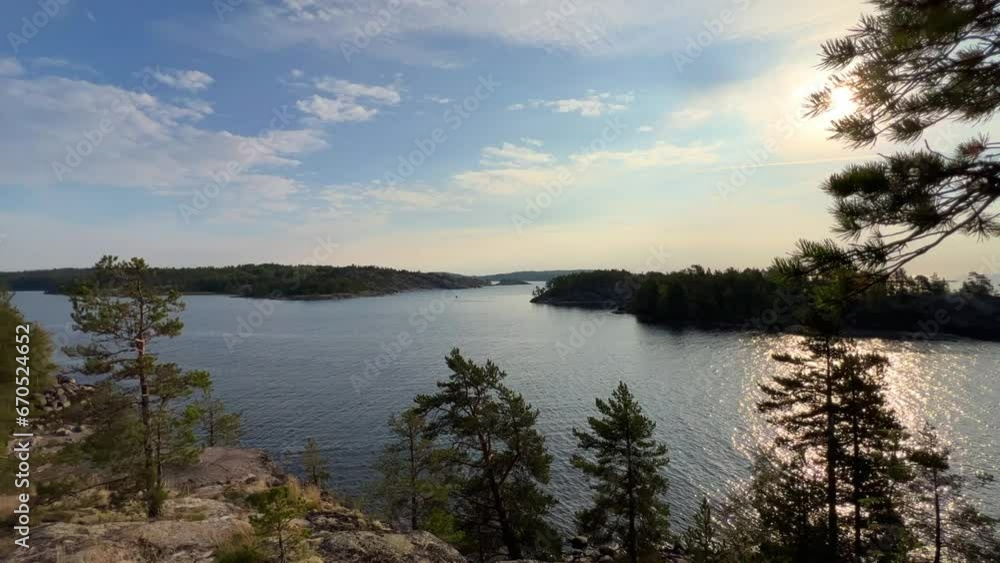 Russia, Karelia, Lake Ladoga, Koyonsaari. View of the coast of the island in a cold lake. Beautiful nature of the Republic of Karelia. Stunning panoramic view of the Ladoga Skerry Islands. 4K Russia, Karelia, Lake Ladoga, Koyonsaari. View of the coast of the island in a cold lake. Beautiful nature of the Republic of Karelia. Stunning panoramic view of the Ladoga Skerry Islands. 4K