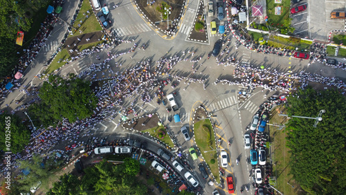 A bird's-eye view of people marching The tradition of eating precepts and eating vegetables in Phuket, Thailand.