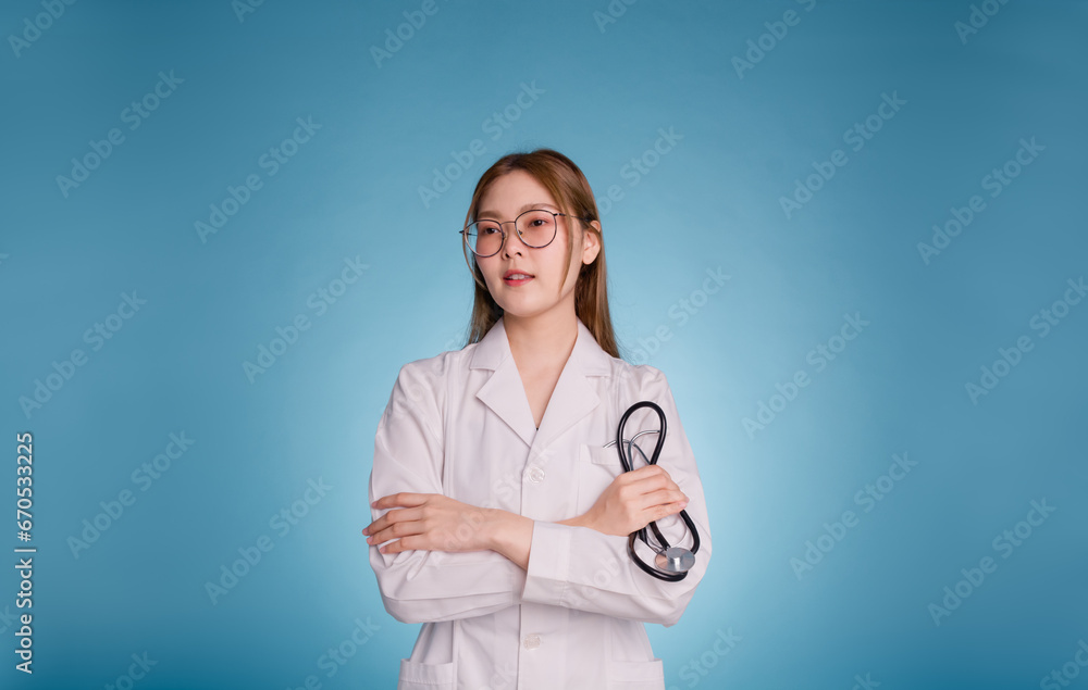 Portrait of smiling female doctor posing with arms crossed and