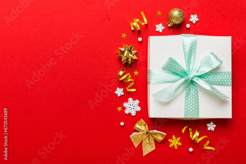 Top view Flat lay Christmas decorations and gift box on colored background with copy space. Christmas or Happy New Year composition © sosiukin
