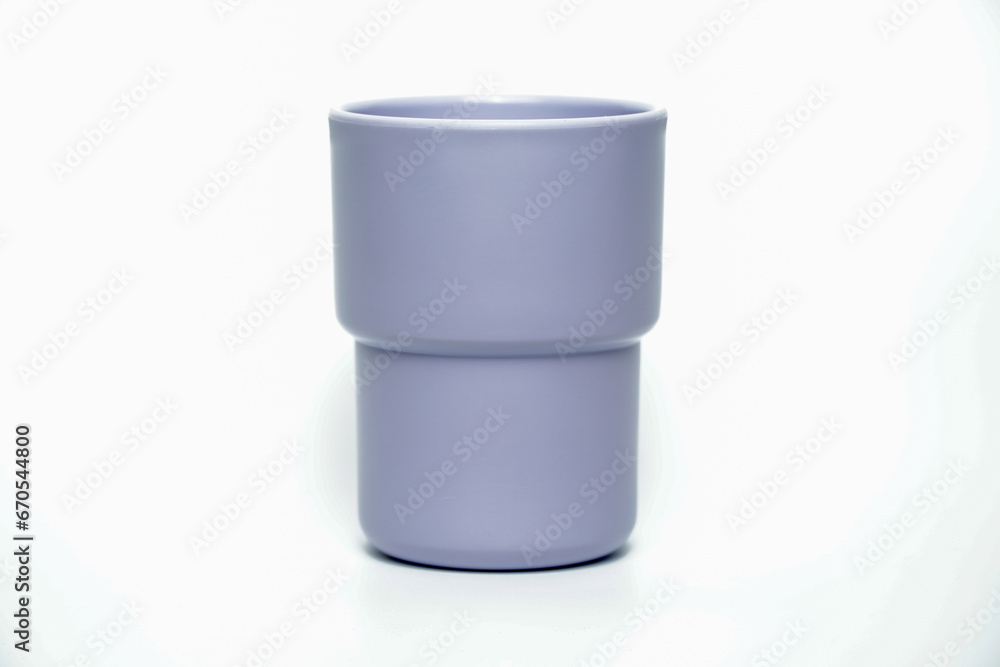 plastic mugs purple of different colors isolated on white background plastic mugs purple of different colors isolated on white background