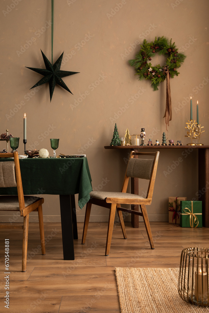 Interior design of warm dinning room interior with christmas table, wooden console, christmas gifts, gingerbread, candle, star on wall christmas wreath and personal accessories. Home decor. Template. - obrazy, fototapety, plakaty 
