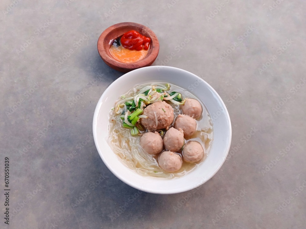stew with vegetables. bakso or Indonesian meatball soup with noodles. soup filled with vermicelli, meatballs and vegetables.
stew with vegetables. bakso or Indonesian meatball soup with noodles. soup filled with vermicelli, meatballs and vegetables.
