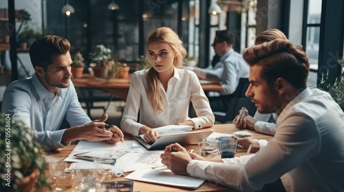 Young modern people in smart casual wear discussing business while working in the creative, Professional team.