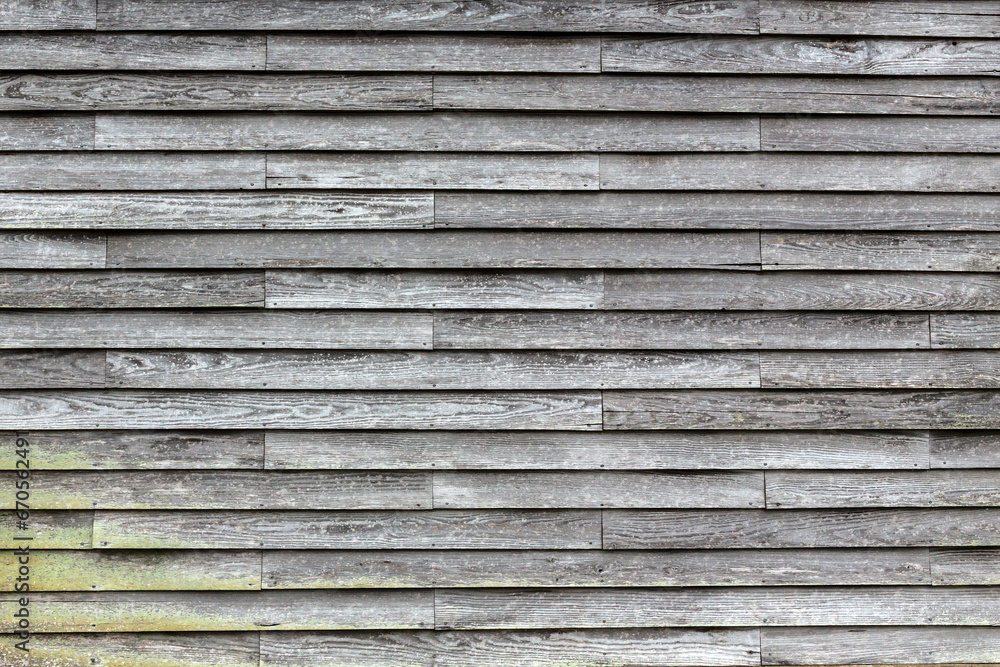 Weathered wood plank building exterior background texture Weathered wood plank building exterior background texture