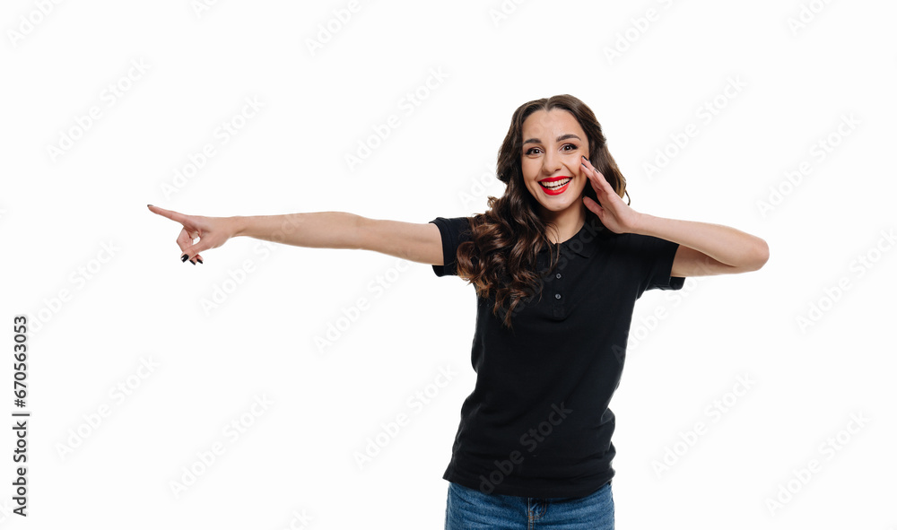 A Woman Pointing in a Black Shirt. A woman in a black shirt is pointing at something A Woman Pointing in a Black Shirt. A woman in a black shirt is pointing at something