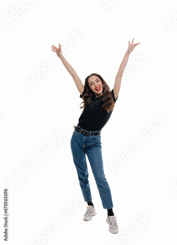 Joyful Woman Leaping Through the Sky With Exhilaration. A woman jumping in the air with her hands up