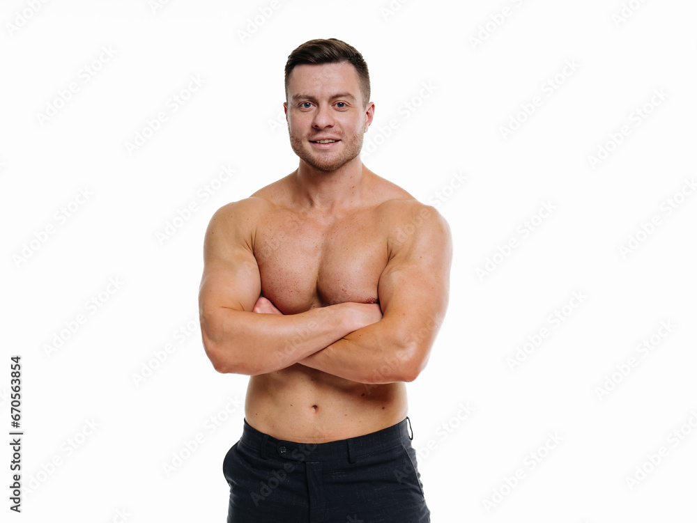 A Confident Man Striking a Pose With Arms Crossed. A man with his arms crossed posing for a picture