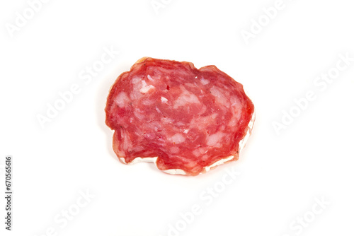 pile of red salami, on a white