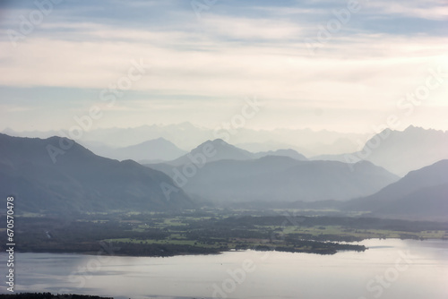 view over Lake Chiemsee to the Alps with clouds and blue sky