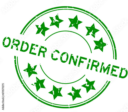 Grunge green order confirmed word with star icon round rubber seal stamp on white background