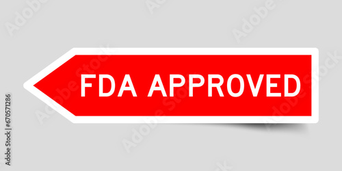 Red color arrow shape sticker label with word FDA approved on gray background
