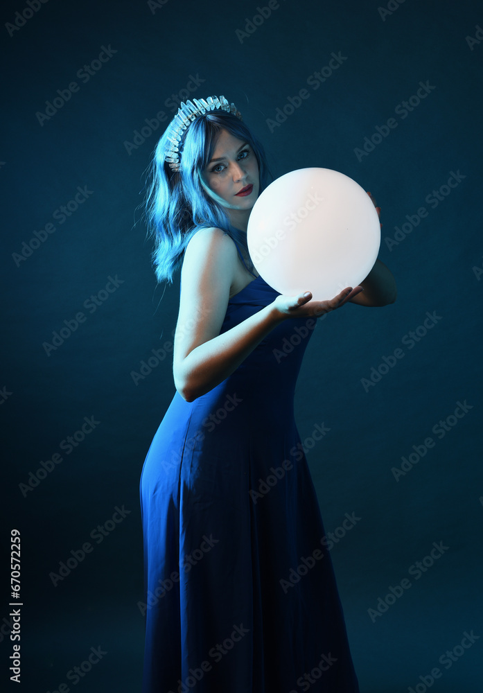 Close up portrait of beautiful female model with blue hair wearing ...