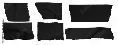 Set of pieces of black paper tape on a blank background.