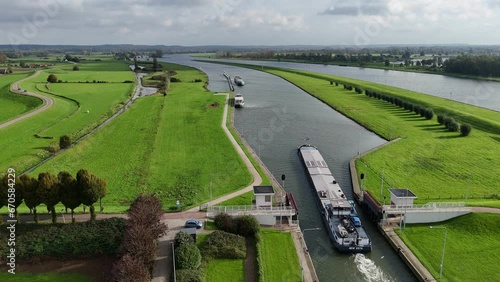 Cargo ship sails through the lock in Amerongen, the Netherlands photo