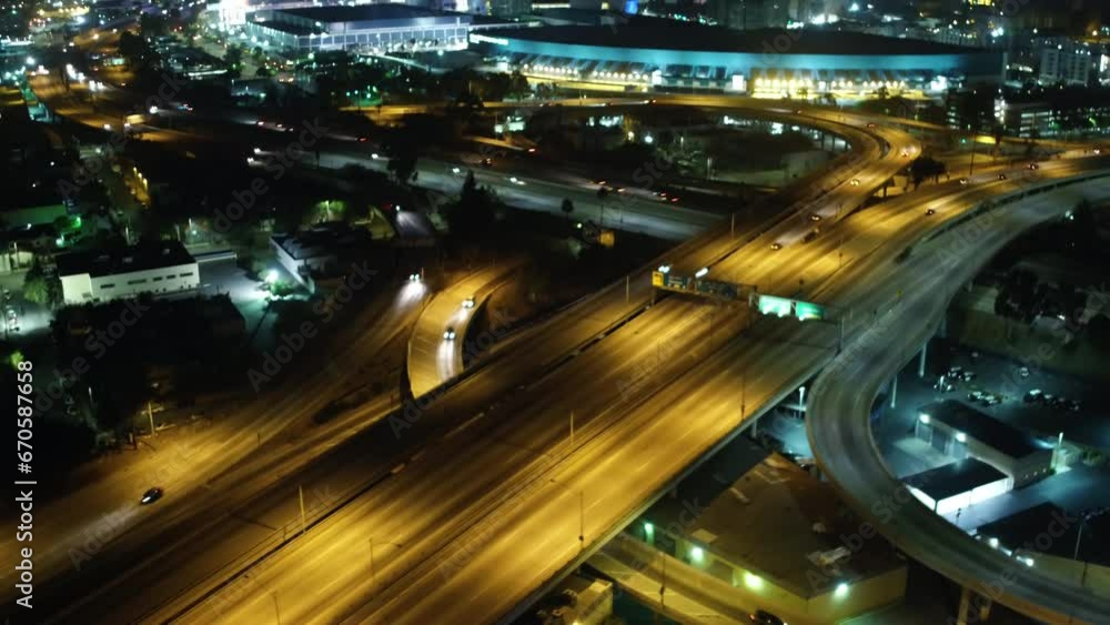 Aerial Tilt Up Shot Of Vehicles On Bridges Near Modern Buildings In City Against Sky - Los Angeles, California Aerial Tilt Up Shot Of Vehicles On Bridges Near Modern Buildings In City Against Sky - Los Angeles, California