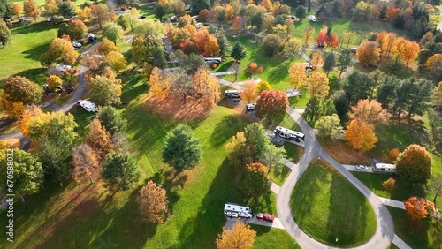 Campground with RVs and  people camping outdoors in mountains of Pennsylvania during Autumn Fall season at Ives Run in Tioga 