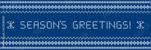 Season's greetings banner concept as knitwear textile design. Blue sweater with pattern and greeting knitted into it.
